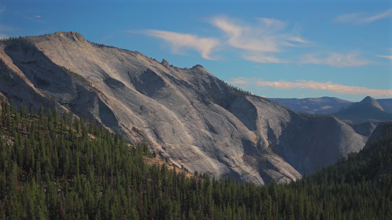 Tioga Pass Yosemite National Park West Portal entrance wilderness forest rugged rocky formation terrain California Lee Vining forest daytime sunny blue sky clouds Sierra Nevada Mountains pano static