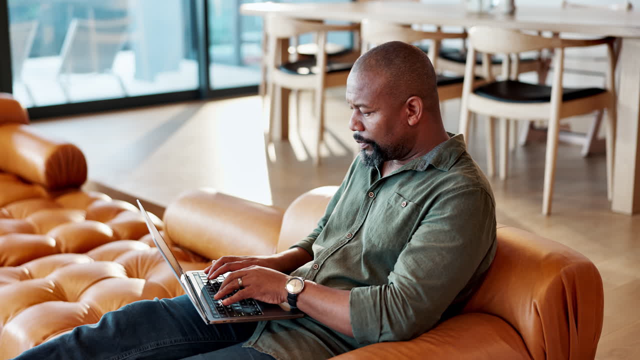 Man working on laptop at home