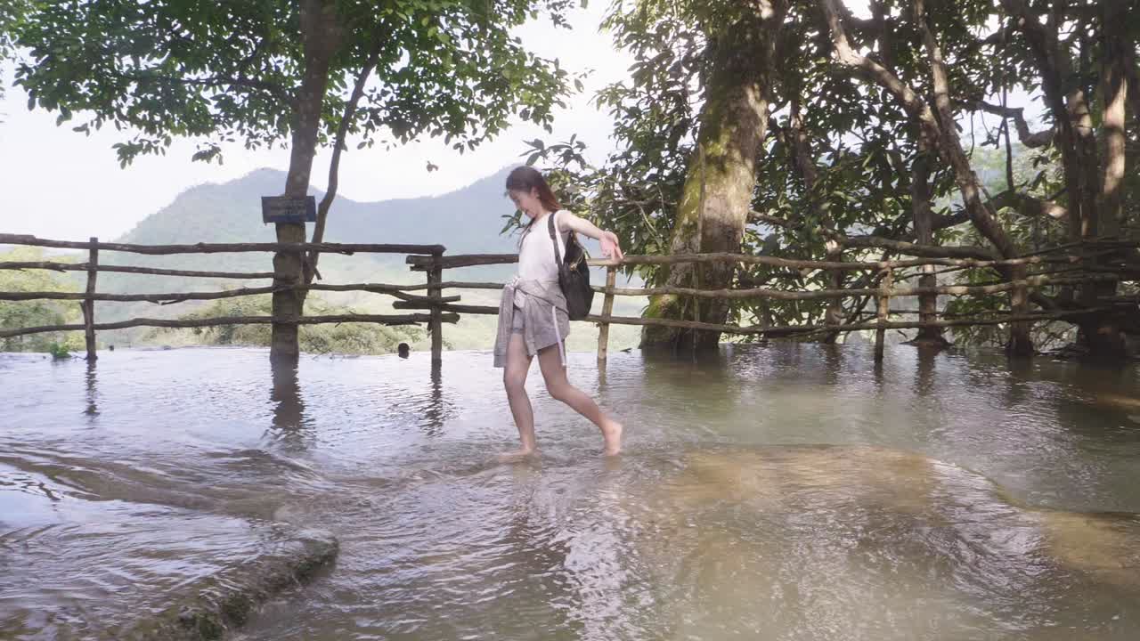 Tourist Woman Walking In The River, Slow Motion