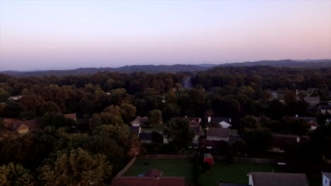 Slow-flight-over-a-typical-suburban-neighborhood-in-Knoxville,-Tennessee-at-dusk