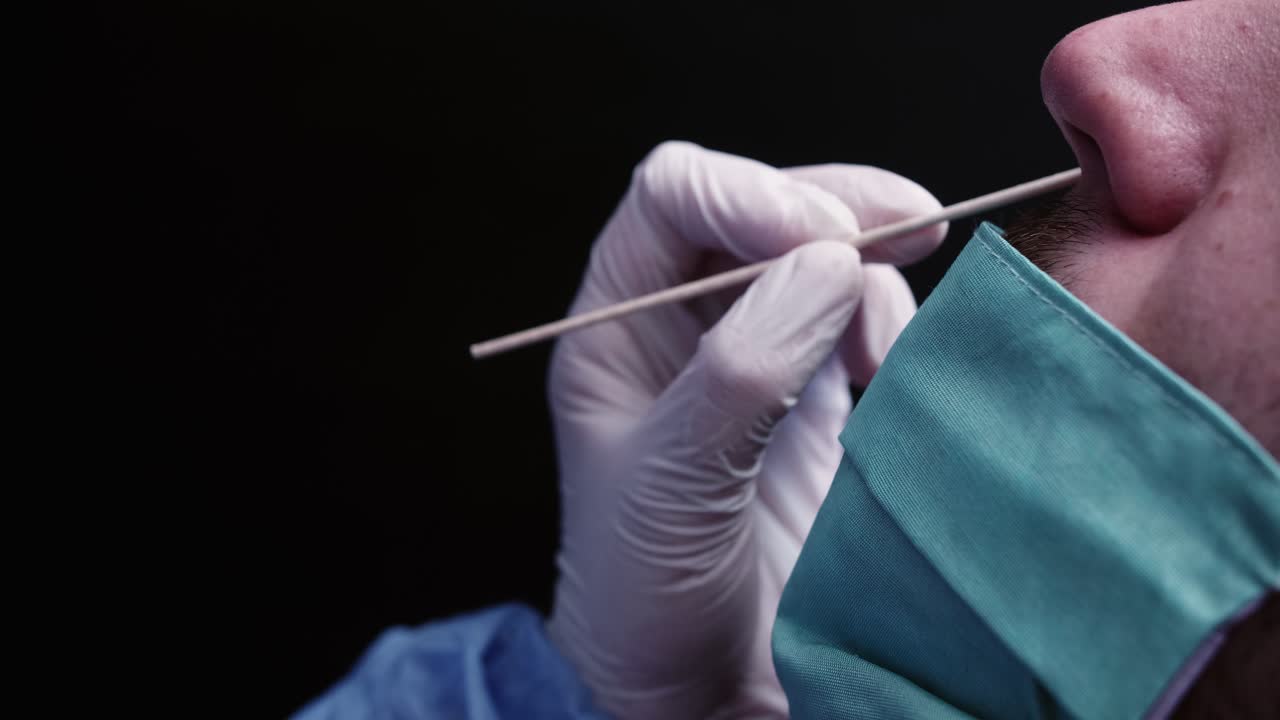 Medical Professional Administering Nasal Swab COVID-19 Test