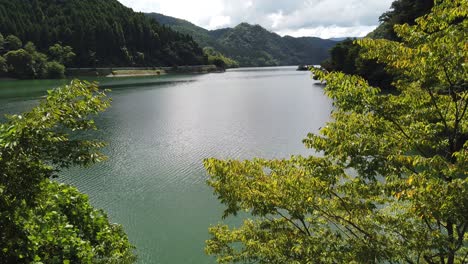 scenic lake valley with mountains in asago hyogo japan, tilt view of serene cloudy summer day