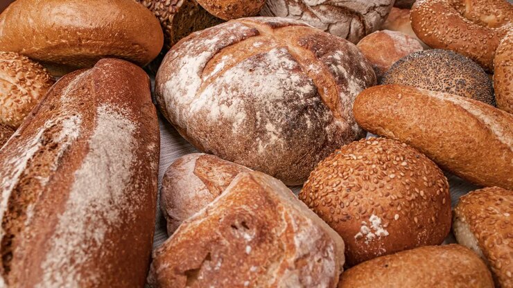 Freshly baked natural bread is on the kitchen table.