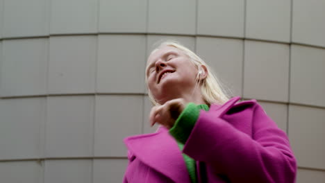 Low-view-of-woman-dancing-in-the-street