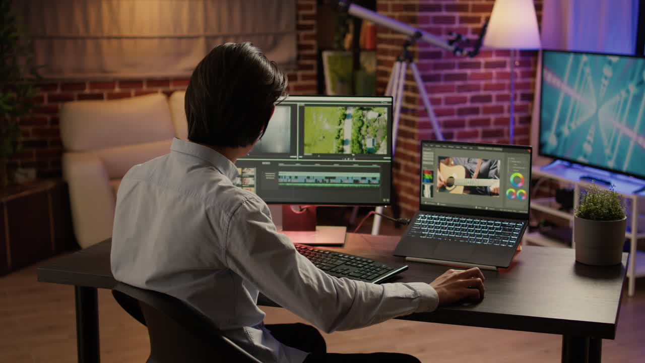 Video editor working on a project in a home office