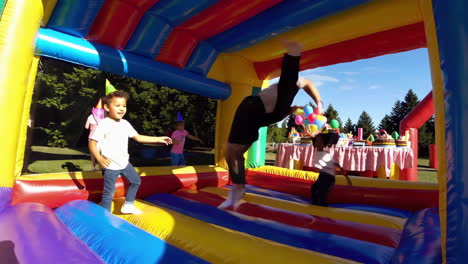 kids having fun at a bounce house party