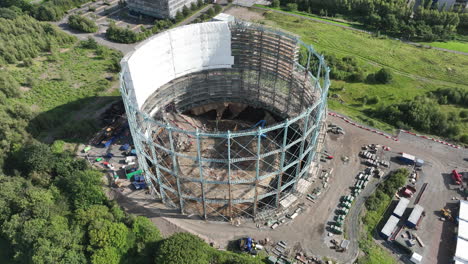 4k aerial of granton gasholder under construction, edinburgh, the capital of scotland, united kingdom