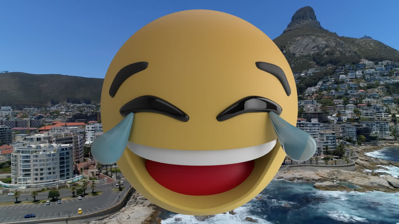Digital composition of changing face emojis against aerial view of the beach