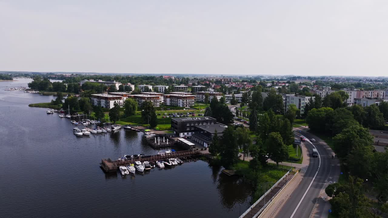 Aerial establishing view Ilawa lakeside Poland city with waterfront apartments