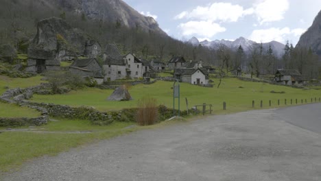 approaching drone shot of the abandoned stone houses in the village of cavergno, in the district of vallemaggia, canton of ticino, in switzerland