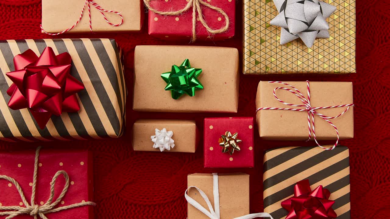 Stop motion animation with Christmas New year gift boxes appear on red cover