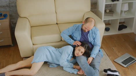 couple in love relaxing on carpet