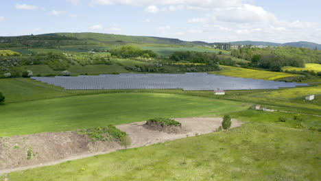 Rows-of-solar-panels-installed-in-a-grass-field-in-Czech-countryside