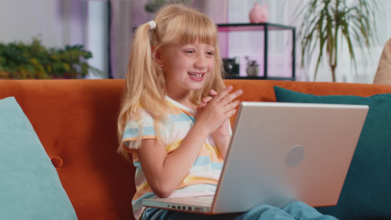 Amazed teen girl use laptop computer receive good news message shocked by victory celebrate win