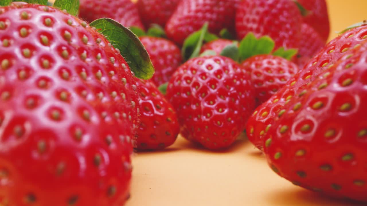 Pile of fresh strawberries on table
