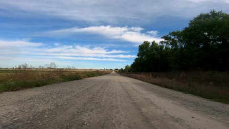 Point-of-view-footage-while-driving-down-a-gravel-road-in-rural-Iowa