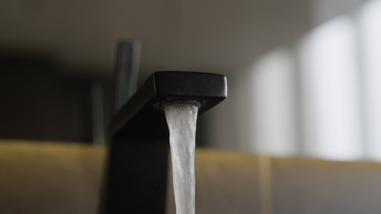 Black Modern Faucet with Water Flowing