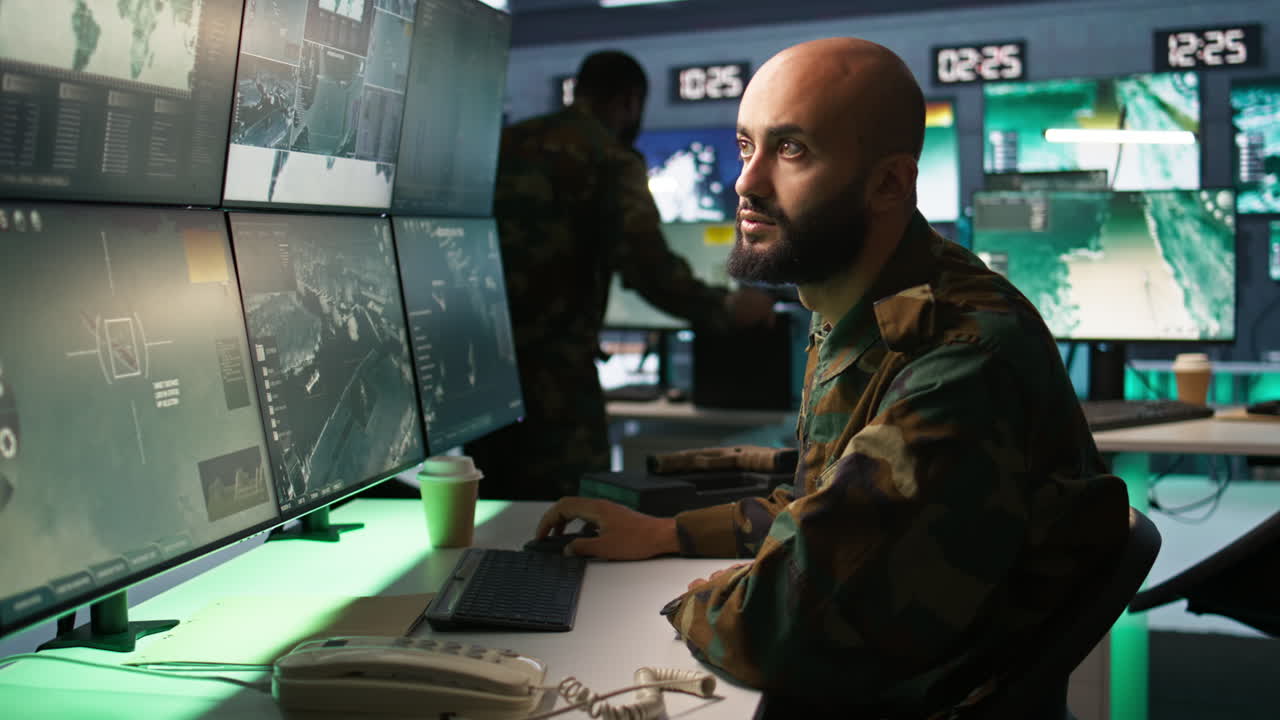 Army specialist overseeing national safety operations with devices, close up