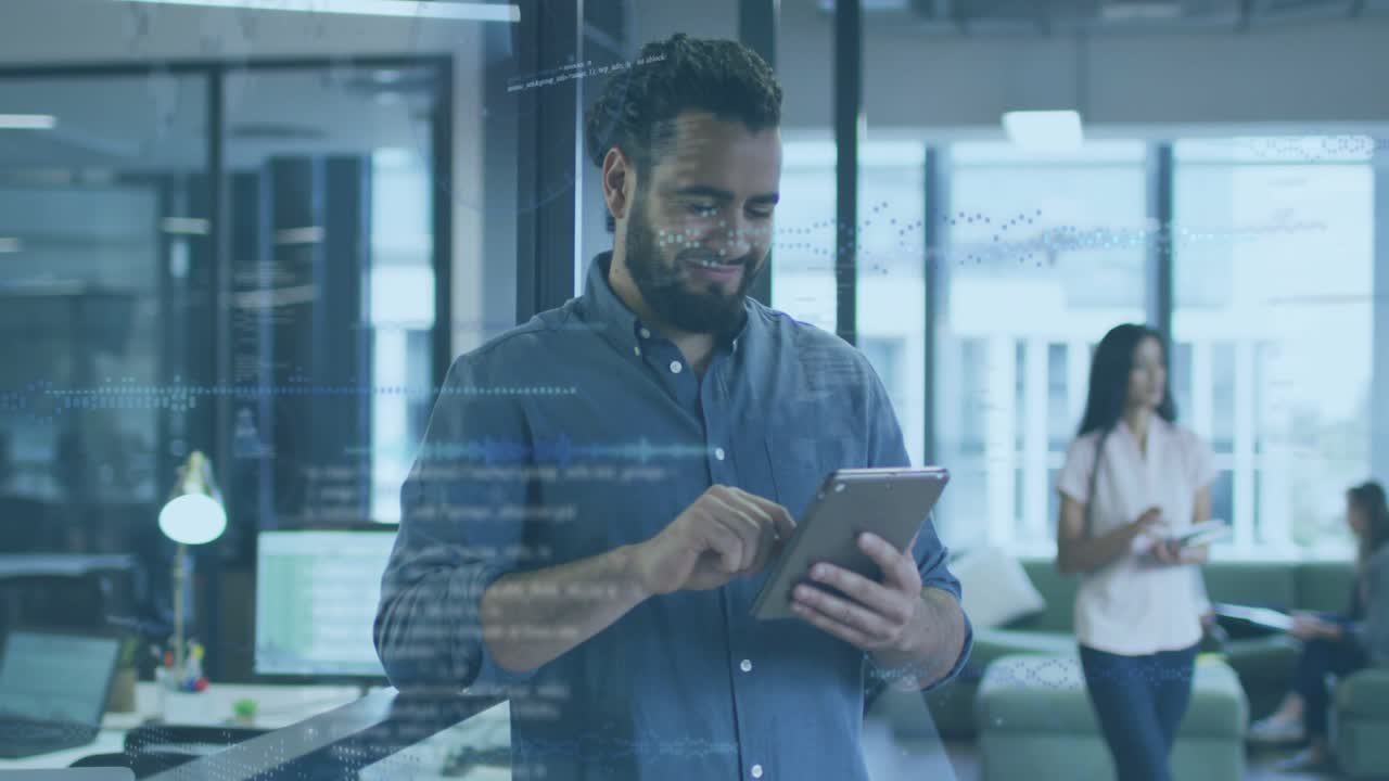 Man tapping tablet at railing pulsing data flows across office driving data analysis