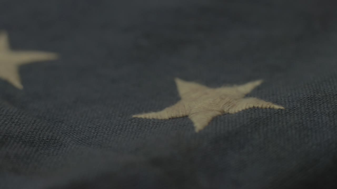 Detail of American flag with 13 stars of the revolution