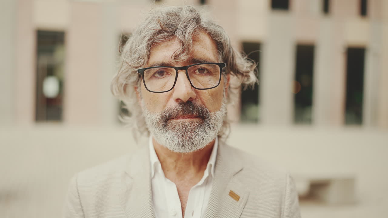 Portrait of a Mature Man with Gray Hair and Beard