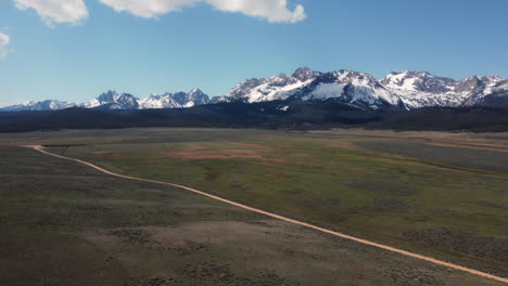 orbiting drone shot of the massive sawtooth mountains in idaho