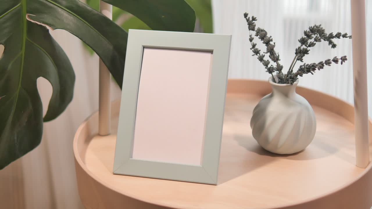 Light Green Picture Frame with Dried Lavender on a Wooden Side Table