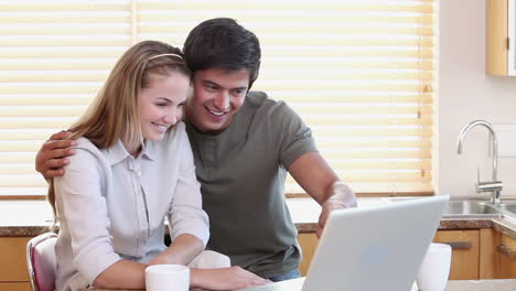 man showing something to his wife