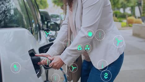 animation of eco icons over caucasian woman charging electric car