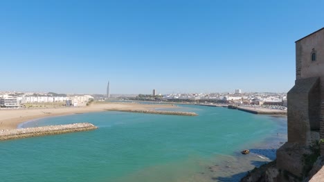 Viewpoint-from-Kasbah-of-the-Udayas,-pan-showing-turquoise-Rabat-water,-day