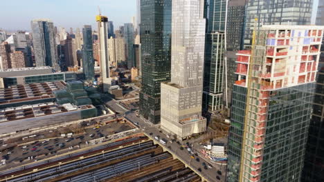 aerial view over the west side yard and the 11th ave in hudson yards, sunset in ny, usa