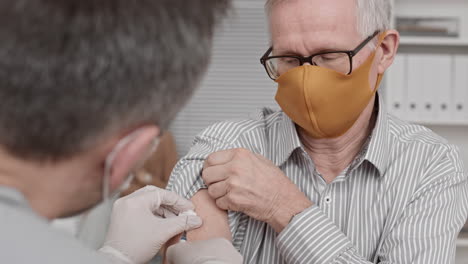 senior man getting medicine injection