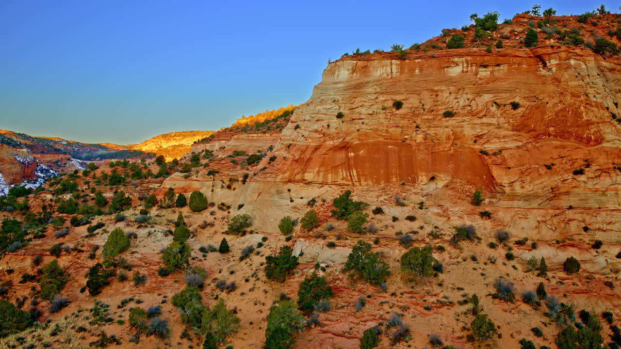 An overhead view shows the winding red canyons and surreal formations near Page, Arizona.