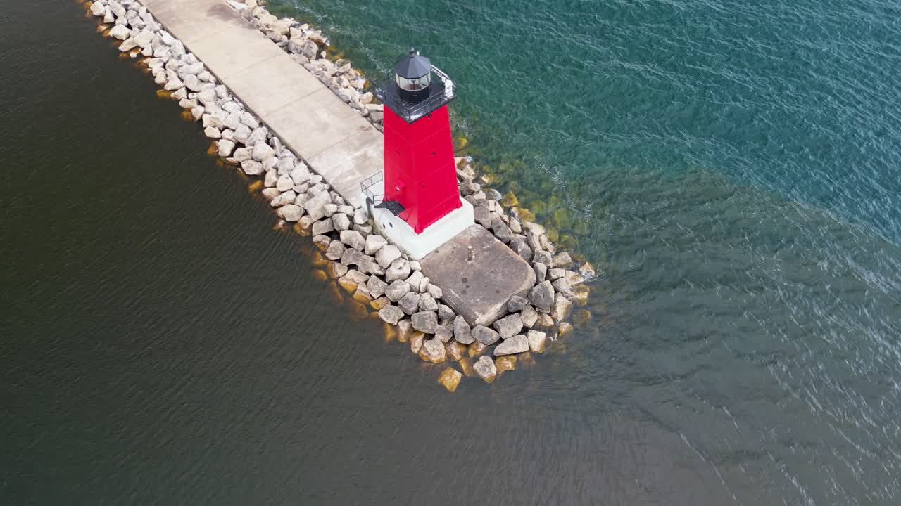 Aerial pan down of Manistique Lighthouse, Michigan