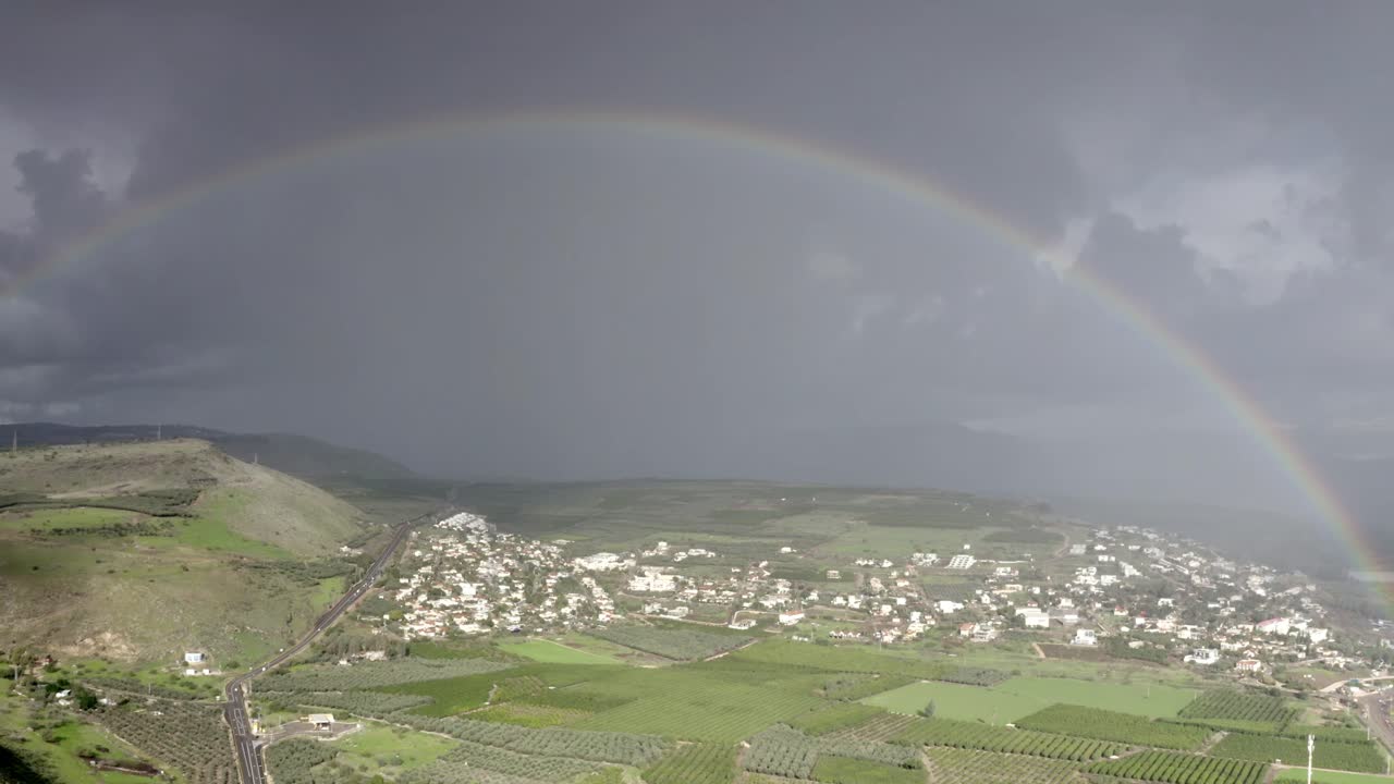 Rainbow over a town and countryside