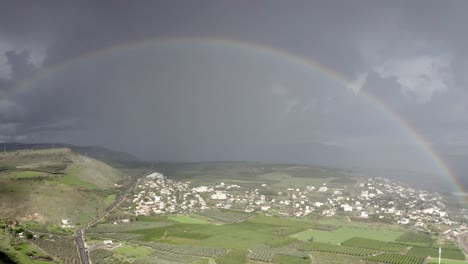 rainbow over a town and countryside