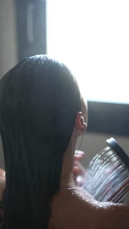 woman washing her hair in the shower