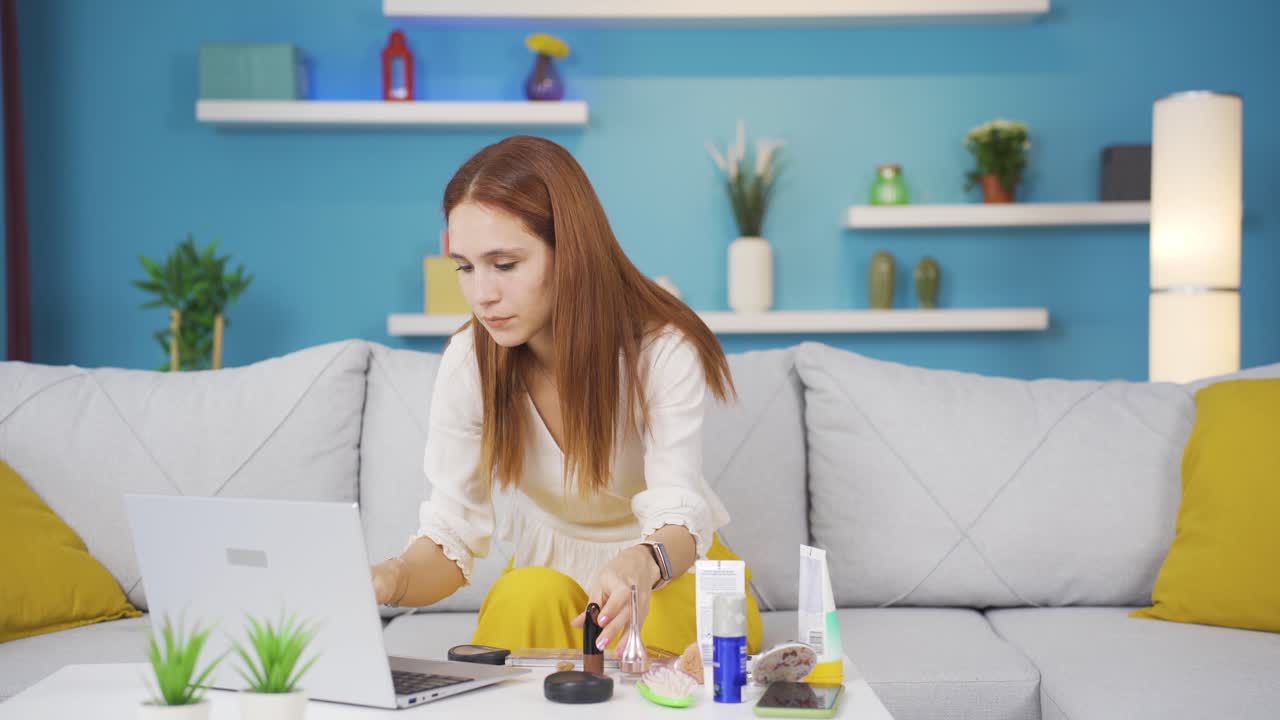 Young woman shopping from laptop.