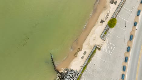 Along-the-coastline-of-Lake-Michigan,-a-display-of-reinforcement-efforts-to-prevent-further-erosion