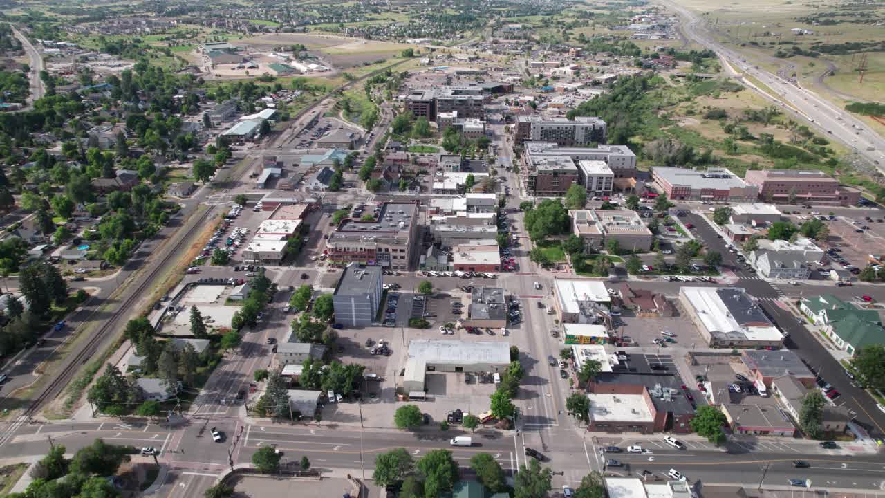 Aerial footage of the city of Castle Rock in Colorado. Camera is heading approximately south