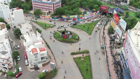men walking through a large circle within an urban city
