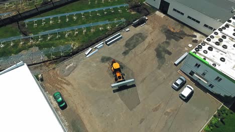 industrial machine in a working yard in the summer. technical equipment carrying instruments for building solar power plant. top view.