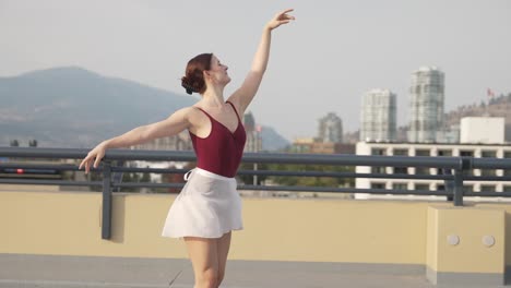 carefree girl dancing on rooftop