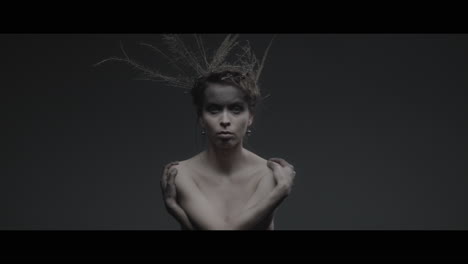 a woman dressed as mother nature rise her head