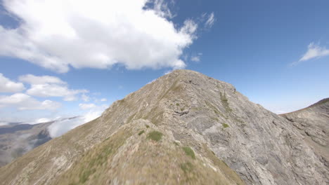 fpv aerial view rising to esterri d'aneu high altitude idyllic mountain peaks, catalonia