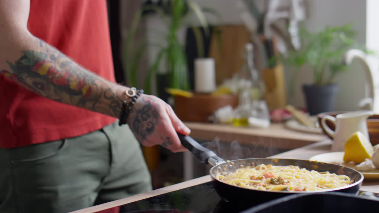 Tossing Spaghetti in Frying Pan