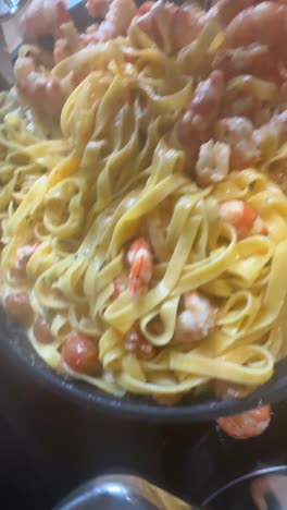 shrimp and pasta in a pan