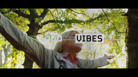 animation of good vibes text over happy woman outdoors