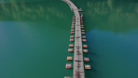 aerial view of floating pontoon bridge in the middle of lake okutama