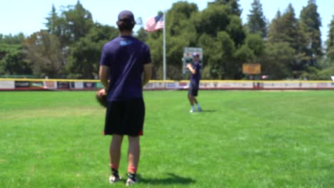 two friends playing catch with a baseball